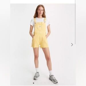 Yellow Levi’s overalls